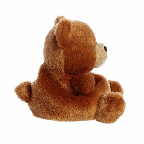 Side view of a brown teddy bear sitting.