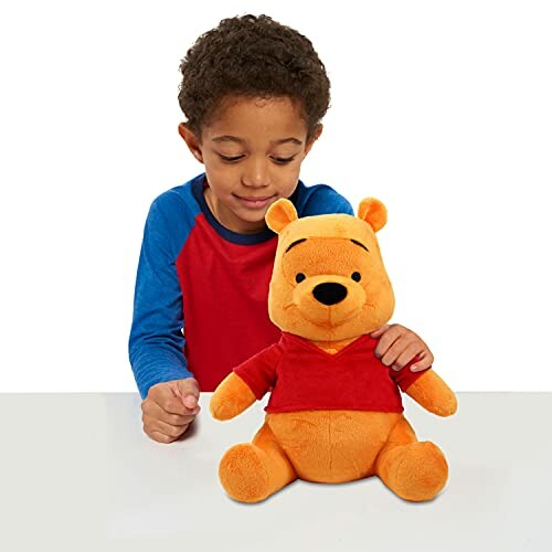 Child with Winnie the Pooh plush toy