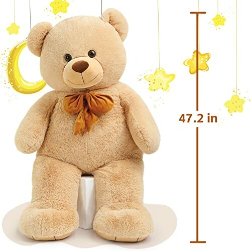 Large teddy bear with a bow, sitting beside a moon and stars, height 47.2 inches.